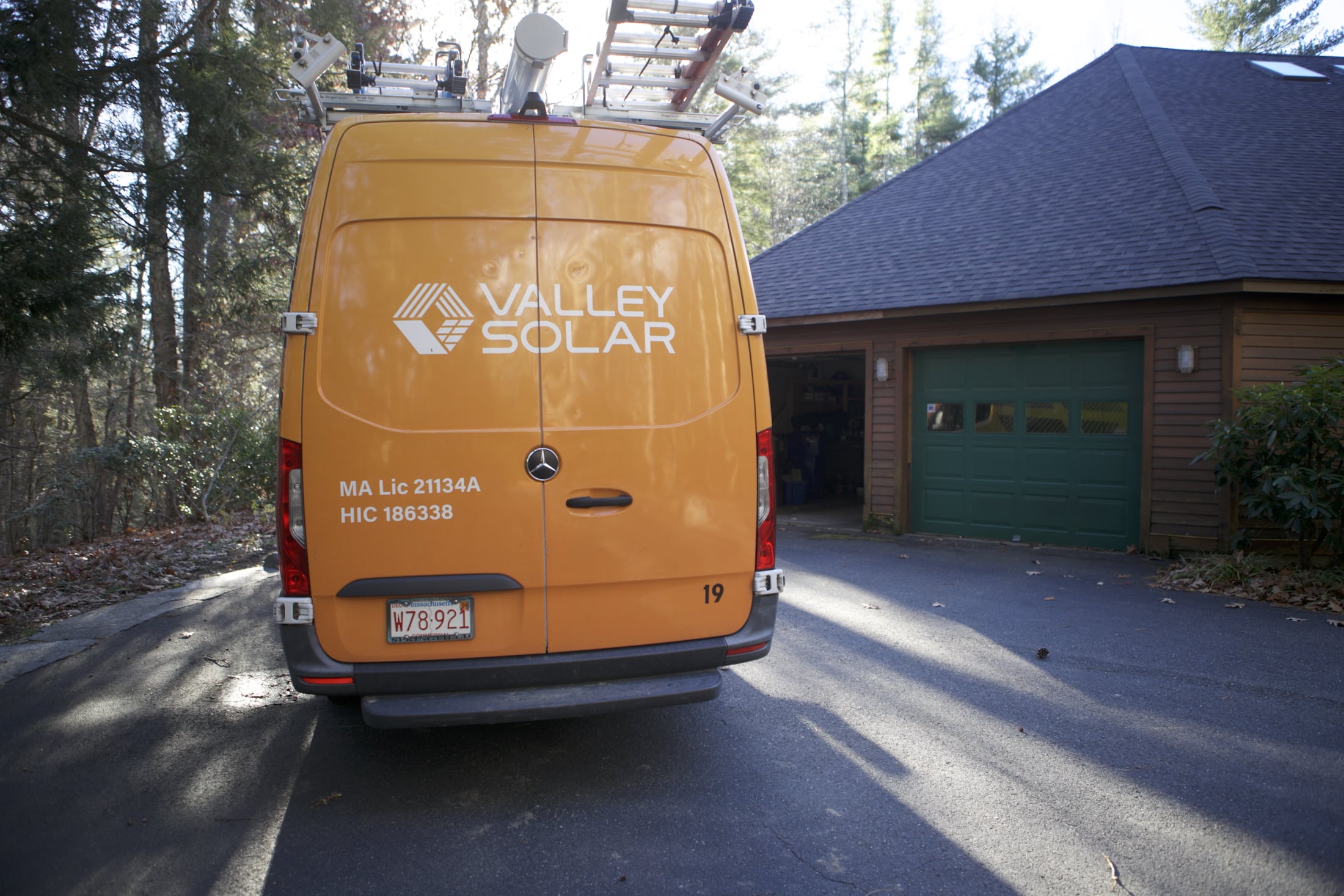 Valley Solar field technician inspecting a commercial inverter